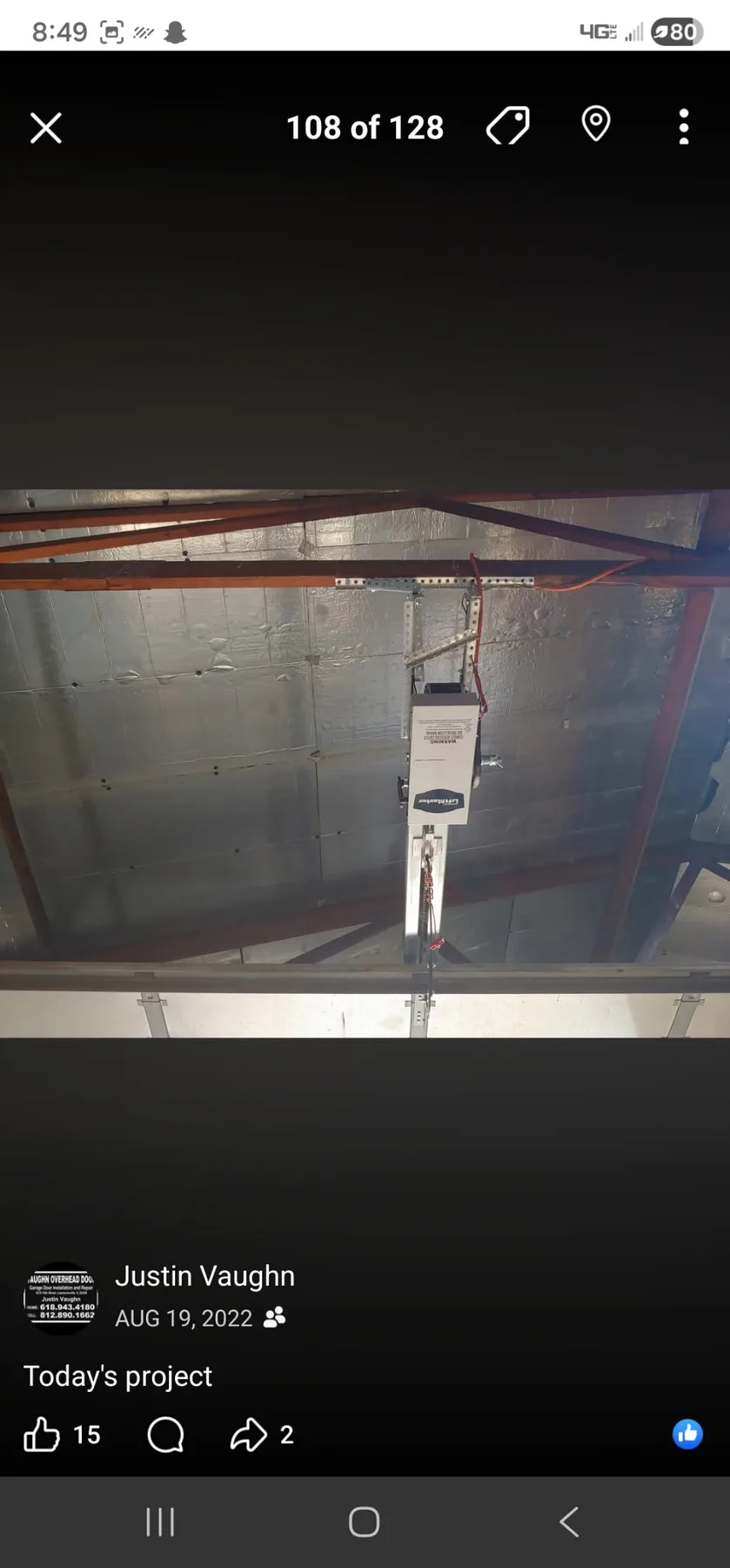 Ceiling-mounted garage door opener in a service installation